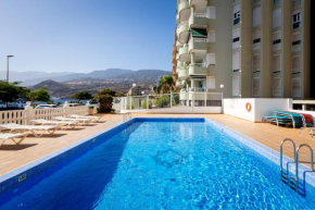 Beachfront with communal swimming pool and parking